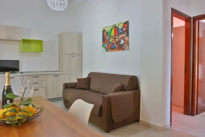 Zona giorno e cucina negli alloggi Paradise Beach — foto 4